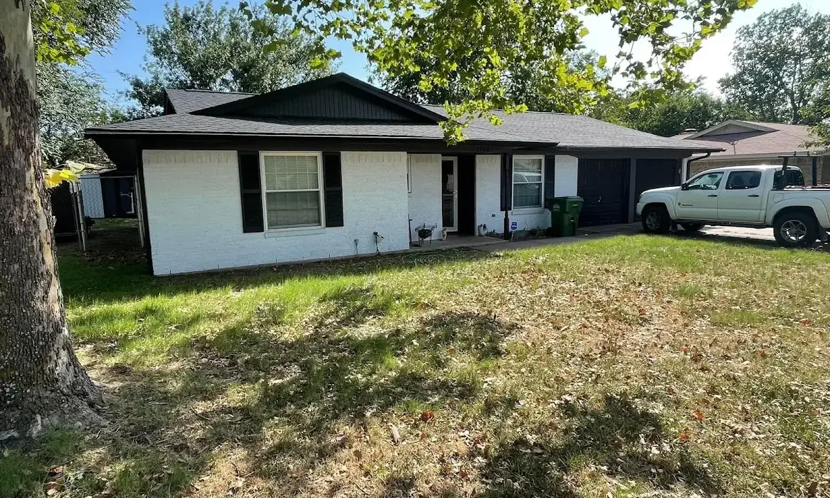 Professional roofing crew working on a residential roof in Briarcliff Manor